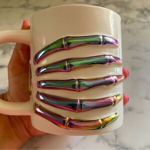Iridescent skeleton hand mug